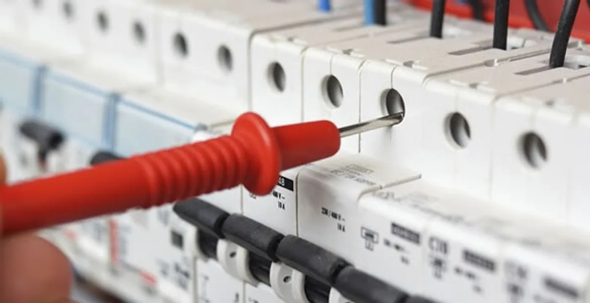 Electrical contractor testing circuit breakers during electrical repair in Boynton Beach, FL