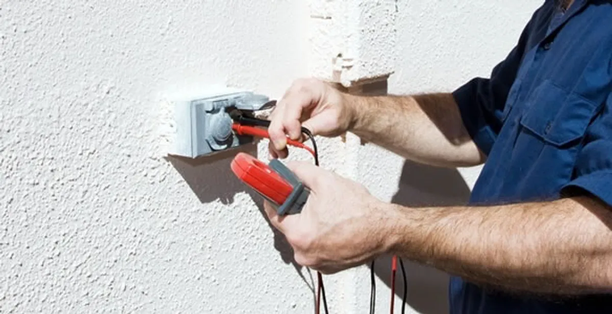 Electrician performing home electrical outlet and wiring inspection in Boca Raton, FL