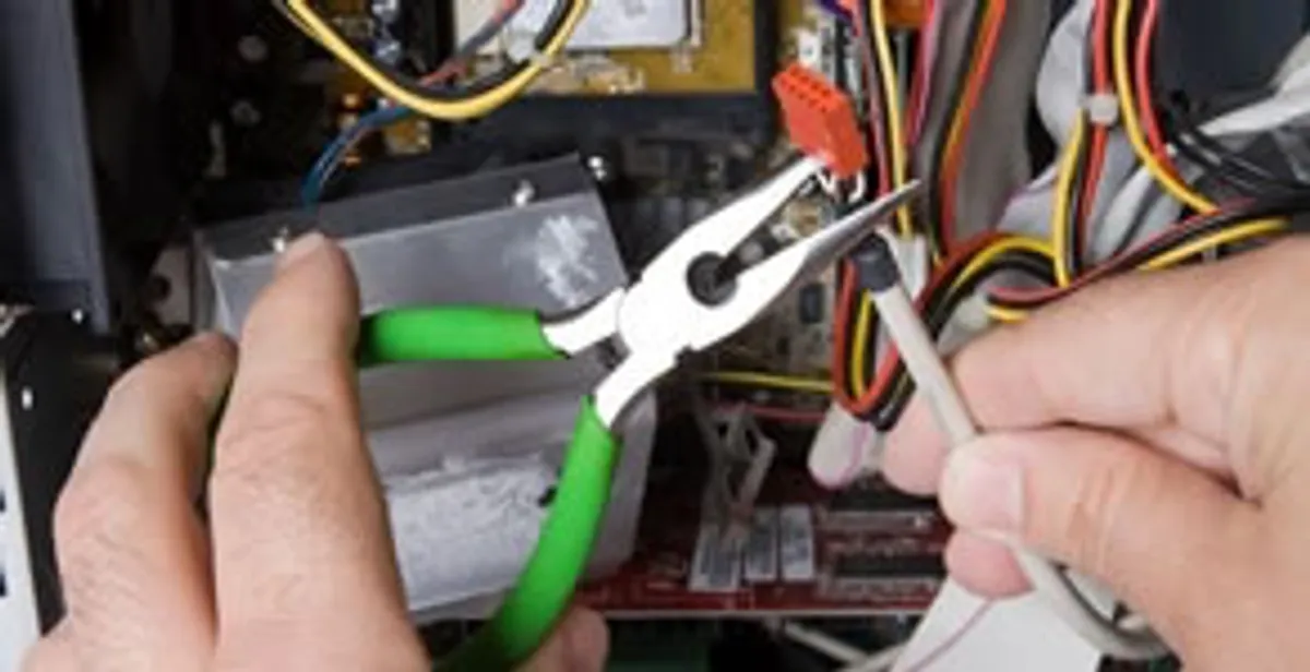 Licensed electrical contractor performing electrical repair with tools in Fort Lauderdale, FL