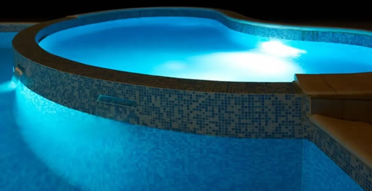 pool light installation and repair services highlighting illuminated pool interior lighting in Boca Raton, FL