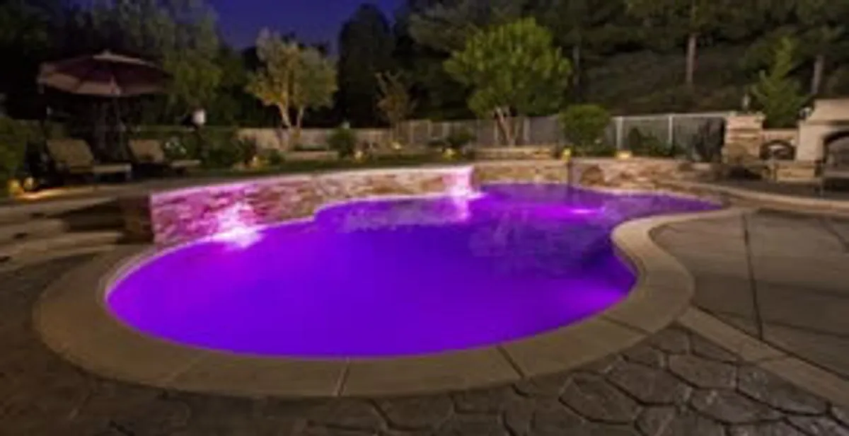 pool light installation and repair services illuminating a residential swimming pool in Boca Raton, FL